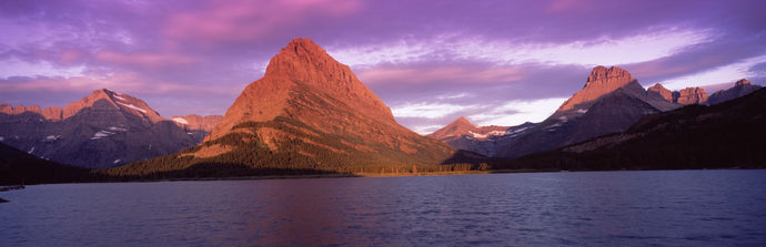 Lake with mountains at dusk, Swiftcurrent Lake, Many Glacier, US Glacier National Park, Montana, USA