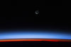 Satellite view of planet Earth showing sunset over Indian Ocean area with crescent moon in the sky