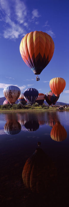 Reflection of hot air balloons in a lake, Hot Air Balloon Rodeo, Steamboat Springs, Routt County, Colorado, USA