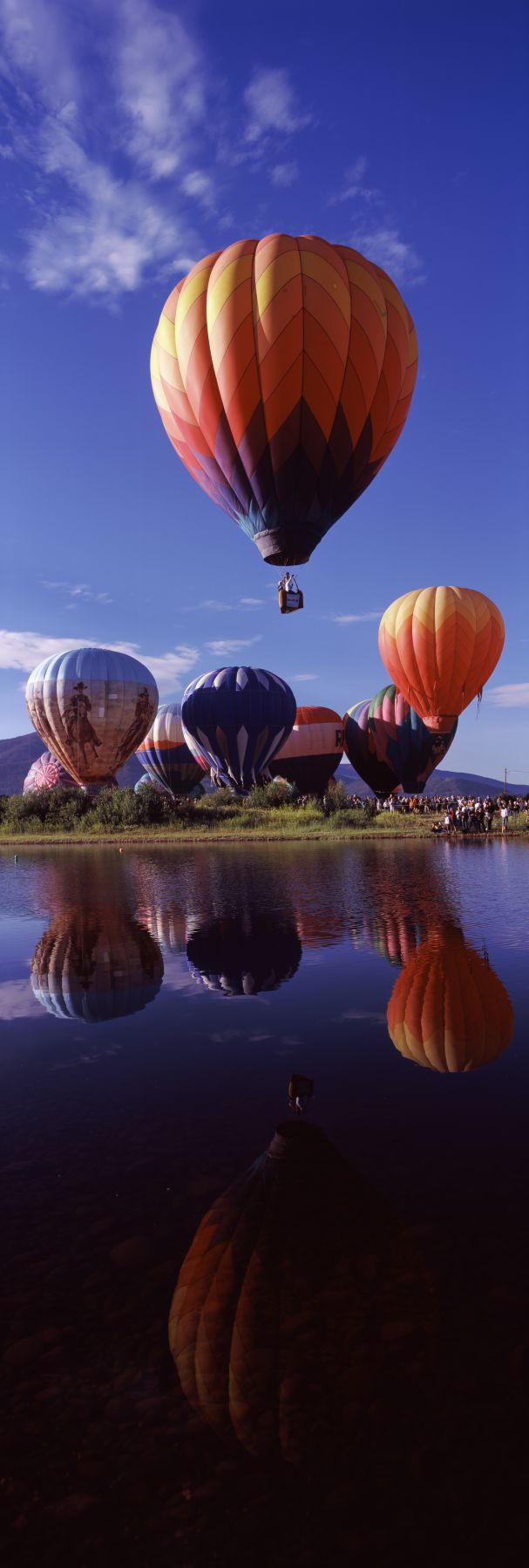 Reflection of hot air balloons in a lake, Hot Air Balloon Rodeo, Steamboat Springs, Routt County, Colorado, USA