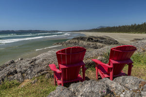 Empty red chairs at coast, Pacific Rim National Park Reserve, Vancouver Island, British Columbia, Canada