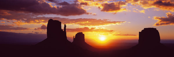 Silhouette of buttes at sunset, Monument Valley, Utah, USA