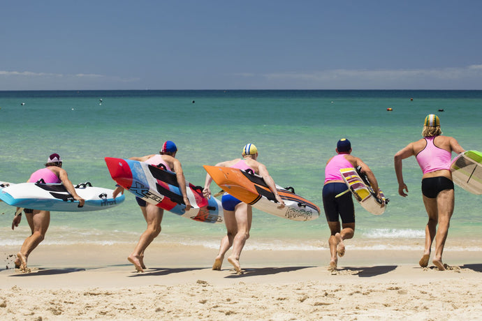 Paddleboarders on the beach, Surfers Paradise, City of Gold Coast, Queensland, Australia