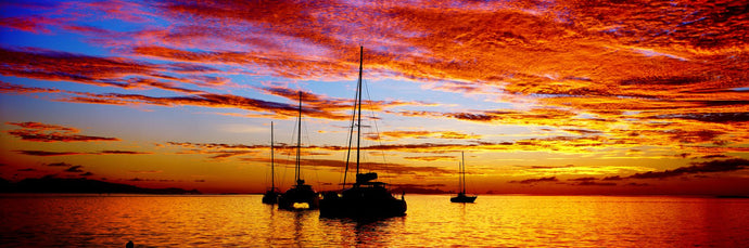 Silhouette of sailboats in the ocean at sunset, Tahiti, Society Islands, French Polynesia