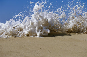 Foam splashing on the beach
