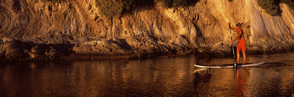 Paddle-boarder in river, Santa Barbara, California, USA