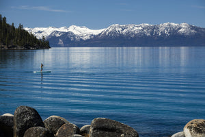 Man paddle boarding in a lake, Lake Tahoe, California, USA