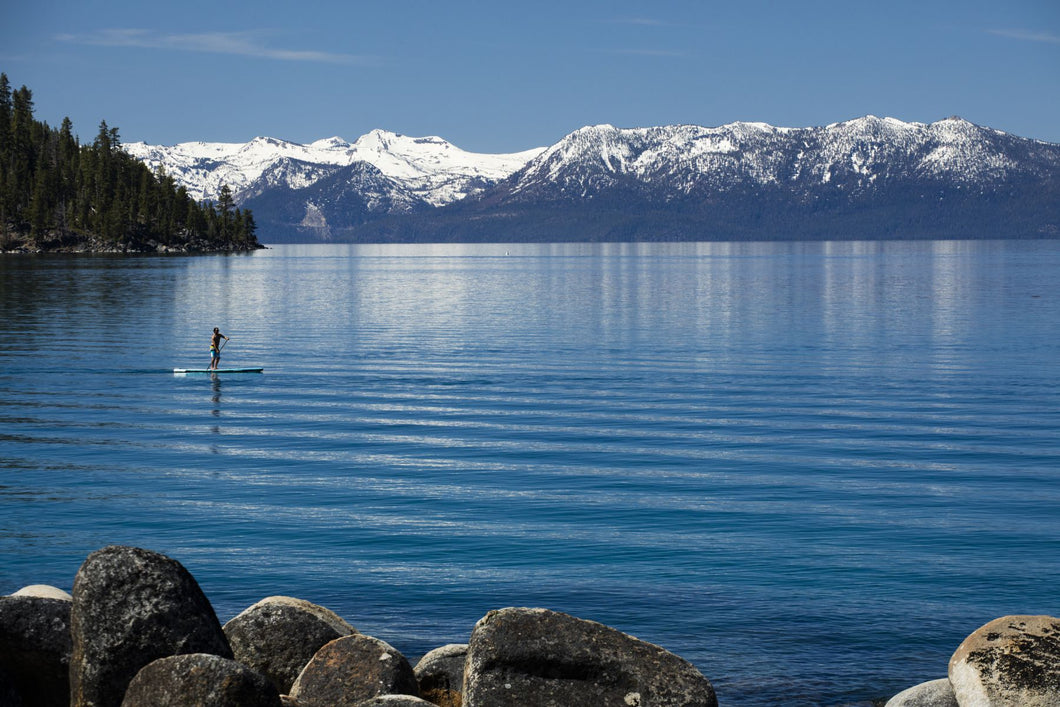 Man paddle boarding in a lake, Lake Tahoe, California, USA
