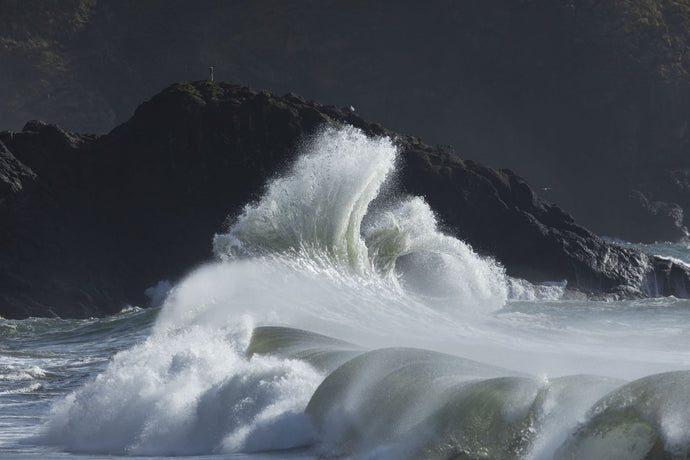 Waves crashing on rock formation in sea, Cape Disappointment State Park, Washington, USA