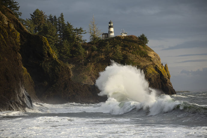 Crashing waves and lighthouse, Cape Disappointment State Park, Washington, USA