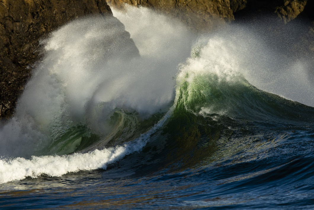 Waves crashing over rocky shore, Cape Disappointment State Park, Washington, USA