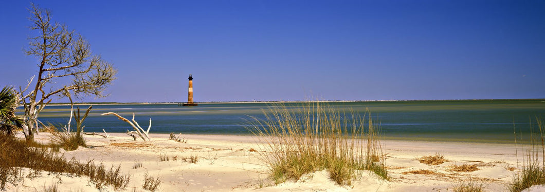 Beach with lighthouse in the background, Morris Island Lighthouse, Morris Island, South Carolina, USA