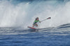Standup paddleboarder surfs a breaking wave in the ocean, Maui, Hawaii, USA