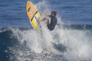 Kai Lenny a famous paddle surfer paddleboarding in the ocean, Ho'Okipa, Maui, Hawaii, USA