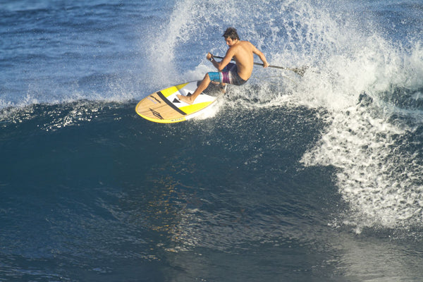 Kody Kerbox a famous paddle surfer paddleboarding in the ocean, Ho'Okipa, Maui, Hawaii, USA