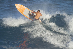 Dave Kalama a famous surfer surfing in the ocean, Ho'Okipa, Maui, Hawaii, USA