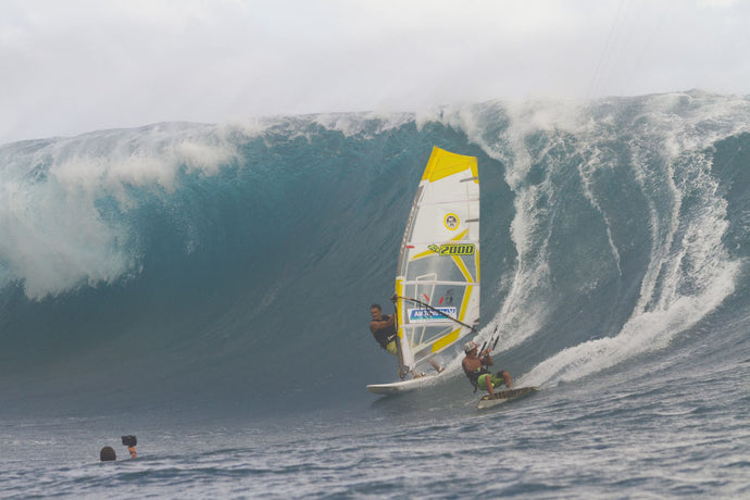 Surfers surfing in the ocean, Teahupo'o, Tahiti, French Polynesia