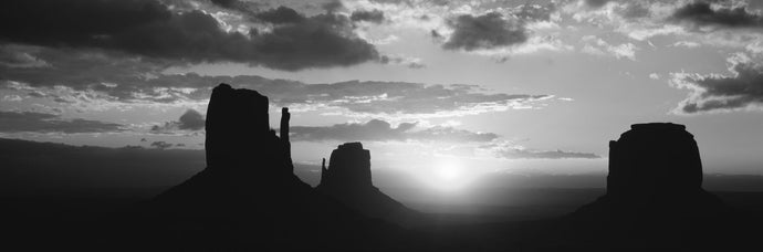 Silhouette of buttes at sunset, Monument Valley, Utah, USA