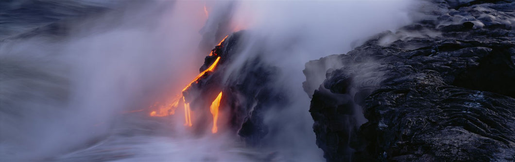 High angle view of lava flowing into the Pacific Ocean, Volcano National Park, Hawaii, USA