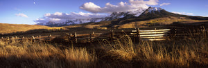 Fence with mountains in the background, Colorado, USA