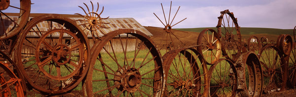 Old barn with a fence made of wheels, Palouse, Whitman County, Washington State, USA
