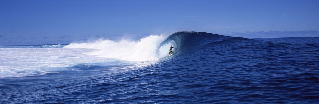 Surfer in the sea, Tahiti, French Polynesia