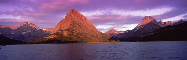 Lake with mountains at dusk, Swiftcurrent Lake, Many Glacier, US Glacier National Park, Montana, USA