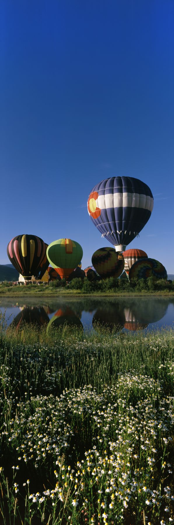 Reflection of hot air balloons in a lake, Hot Air Balloon Rodeo, Steamboat Springs, Routt County, Colorado, USA