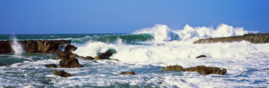 Waves breaking at rocks, Hawaii, USA