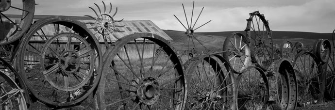 Old barn with a fence made of wheels, Palouse, Whitman County, Washington State, USA