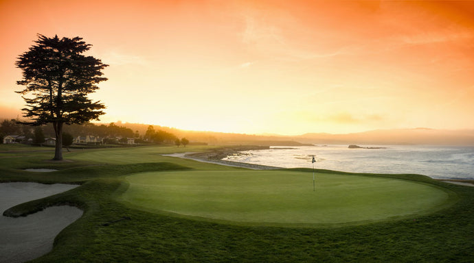 18th Hole with iconic cypress tree at sunrise on Pebble Beach Golf Links, Pebble Beach, California, USA