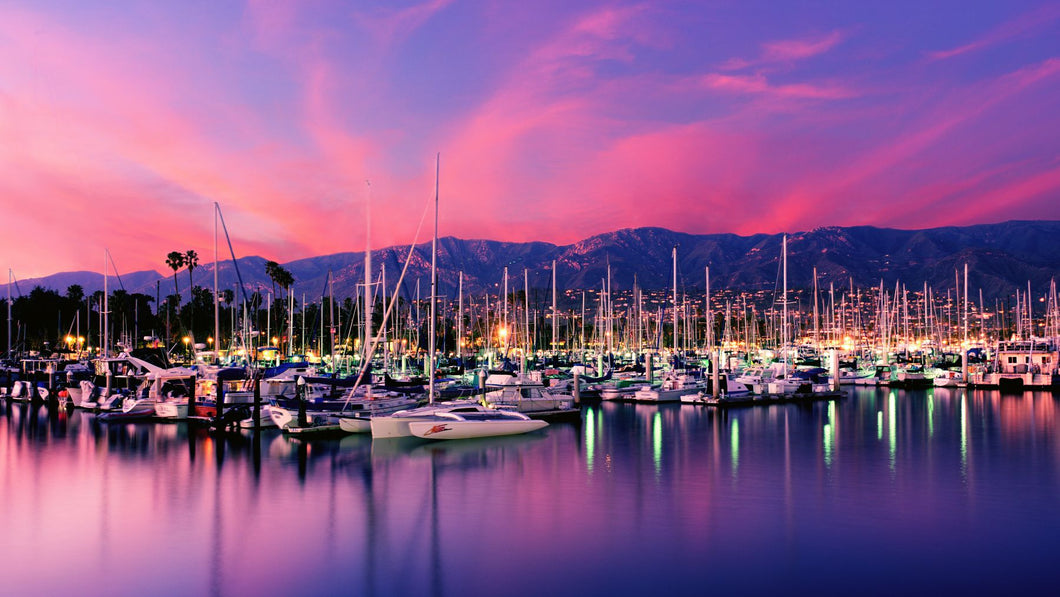 Boats moored in harbor at sunset, Santa Barbara Harbor, Santa Barbara County, California, USA