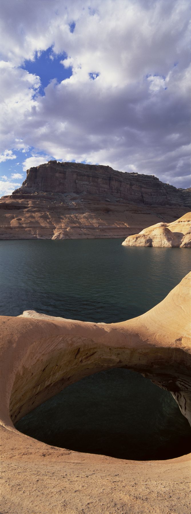 Pothole arch at a lakeside, Lake Powell, Utah, USA