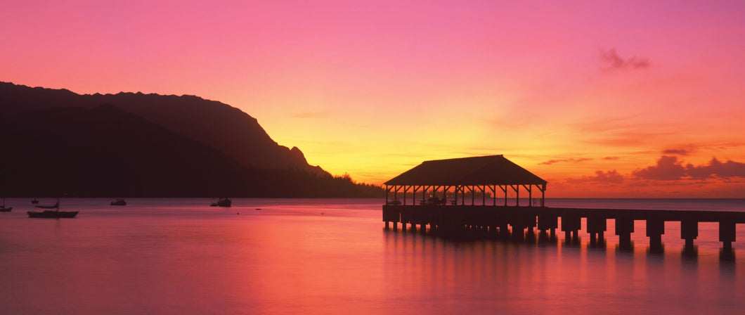 Pier over the ocean at dusk