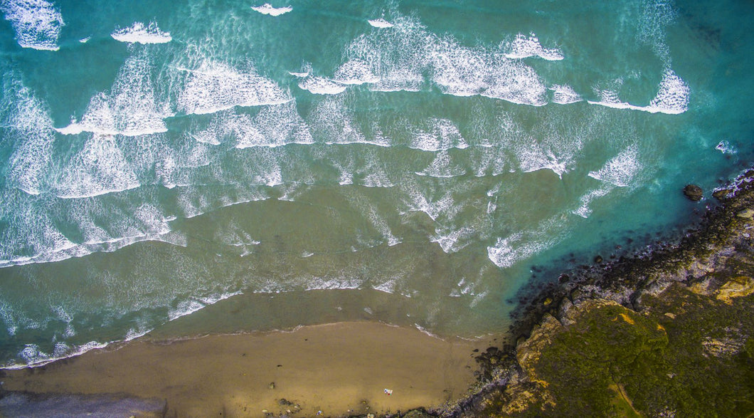 Aerial view of ocean waves on beach, Big Sur, California, USA